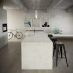 Isla de cocina con barra de desayuno Dekton Lunar