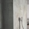 Baño con encimera y revestimiento pared de Dekton Soke