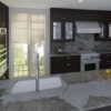 Cocina e isla tradicional de porcelánico Dekton Khalo
