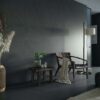 a black living room with Dekton Micron walls and floors