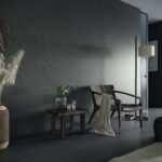a black living room with Dekton Micron walls and floors