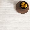 Encimera Arklam Nativa White Natural 12 mm decorada con limones para cocinas en Málaga.