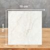 Muestra cuadrada de 10 cm de Dekton Thala sobre fondo gris, con textura marfil y vetas sutiles.