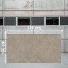 Losa grande de Neolith Artisan de 320 cm x 160 cm en almacén, con superficie gris terrosa.