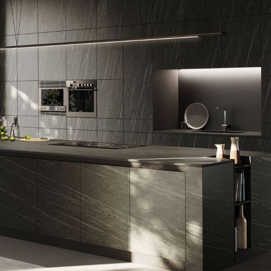 Isla de cocina con encimera Neolith Ignea, electrodomésticos integrados y frutas, ideal para espacios modernos en Málaga