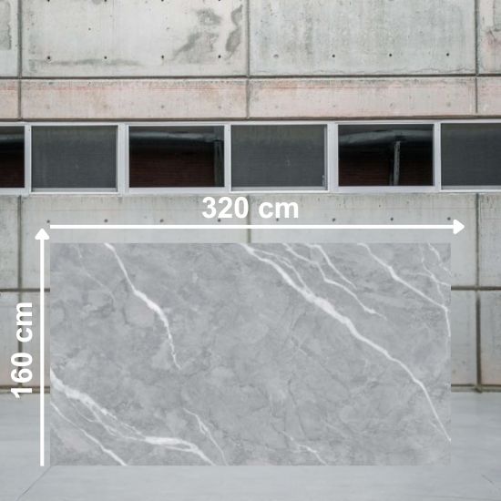 Losa grande de Blaker Total Boreal Grey 320x160 cm gris veteada en almacén industrial.