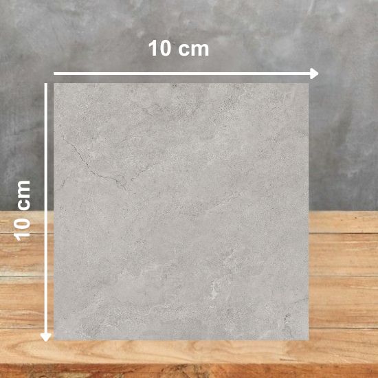 Muestra 10x10 cm de Venux Bourgogne Perle gris uniforme sobre fondo gris.