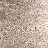 Granito White Evolution detalle textura beige con motas grises y negras