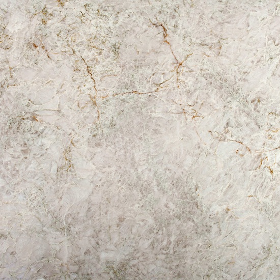 Cuarcita Terra Polaris detalle textura blanca con vetas doradas y oxido