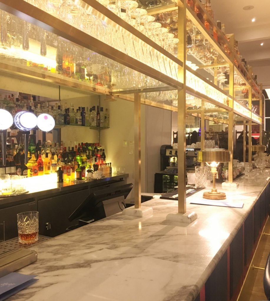 Calacatta marble bar top installed in a hotel or restaurant bar