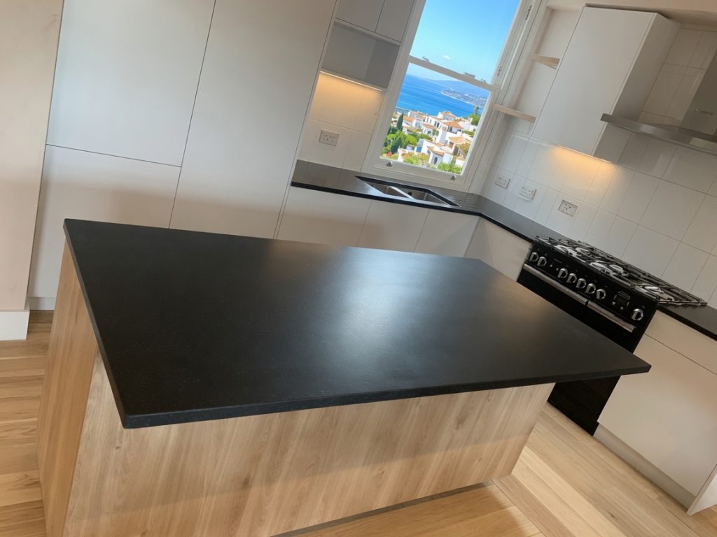 Neolith Nero Zimbabwe black kitchen island with sea views on the Costa del Sol