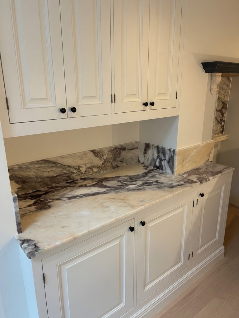 Arabescato Viola marble kitchen worktops with dramatic veining in a Marbella villa