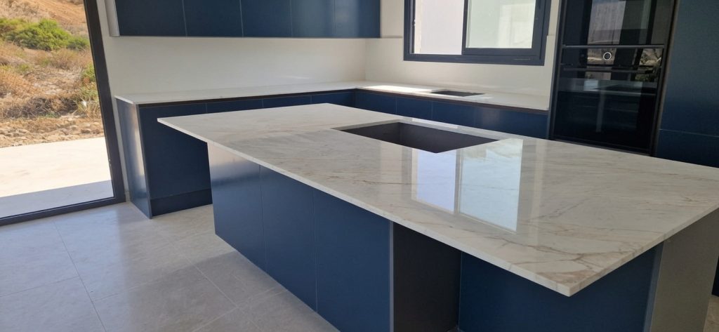 Calacatta marble kitchen island and worktops installed in a Marbella villa