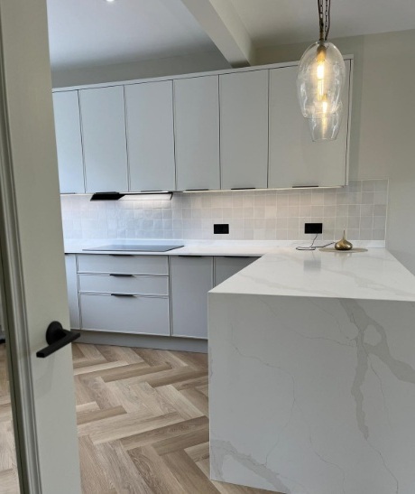 a quartz kitchen island with waterfall edge installed in Marbella