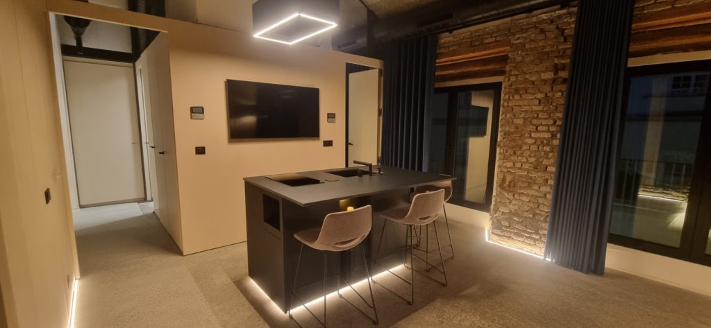 lack porcelain kitchen island installation in boutique hotel by Encimeras Málaga