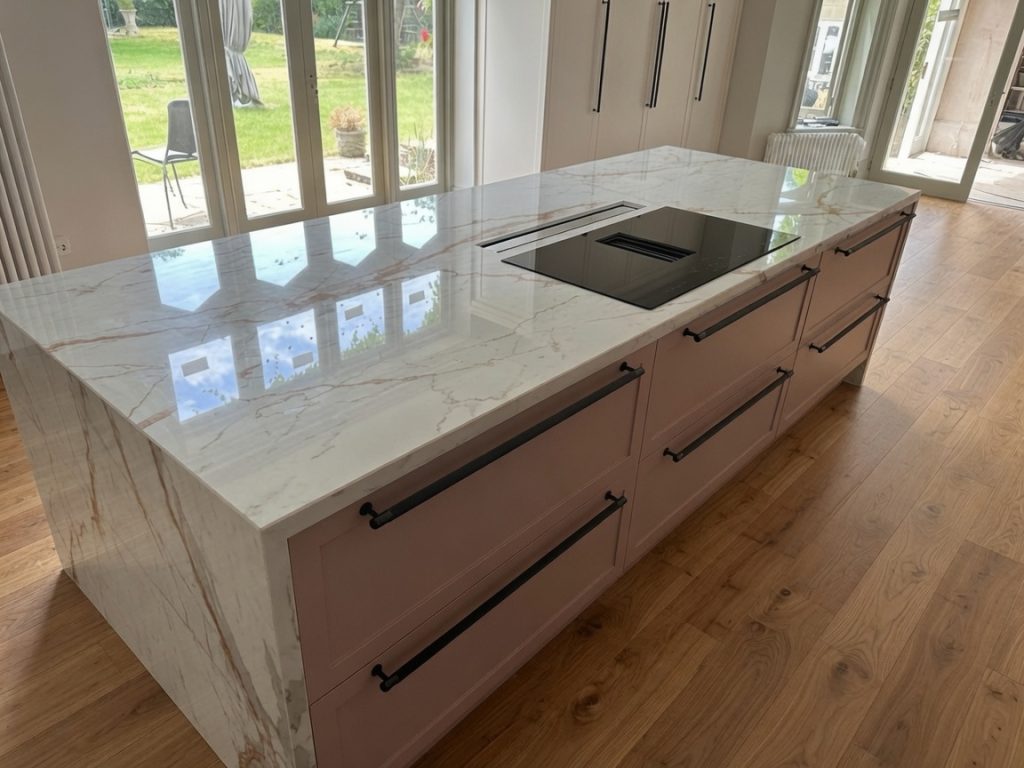 Dekton Awake kitchen island with waterfall double panel mitred edge installed in Marbella