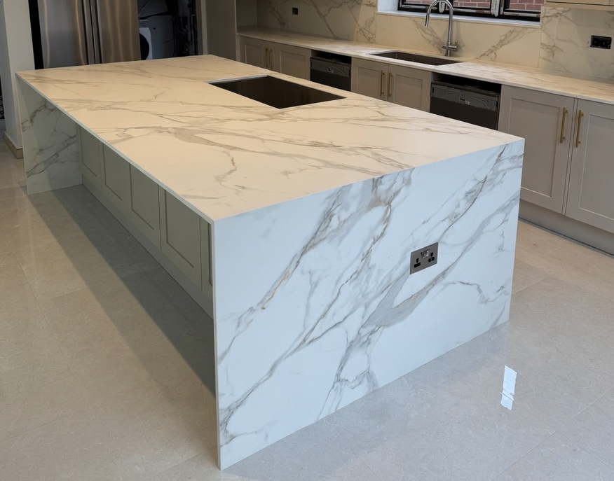 Neolith Calacatta Roma porcelain kitchen island with waterfall edge in a Marbella villa
