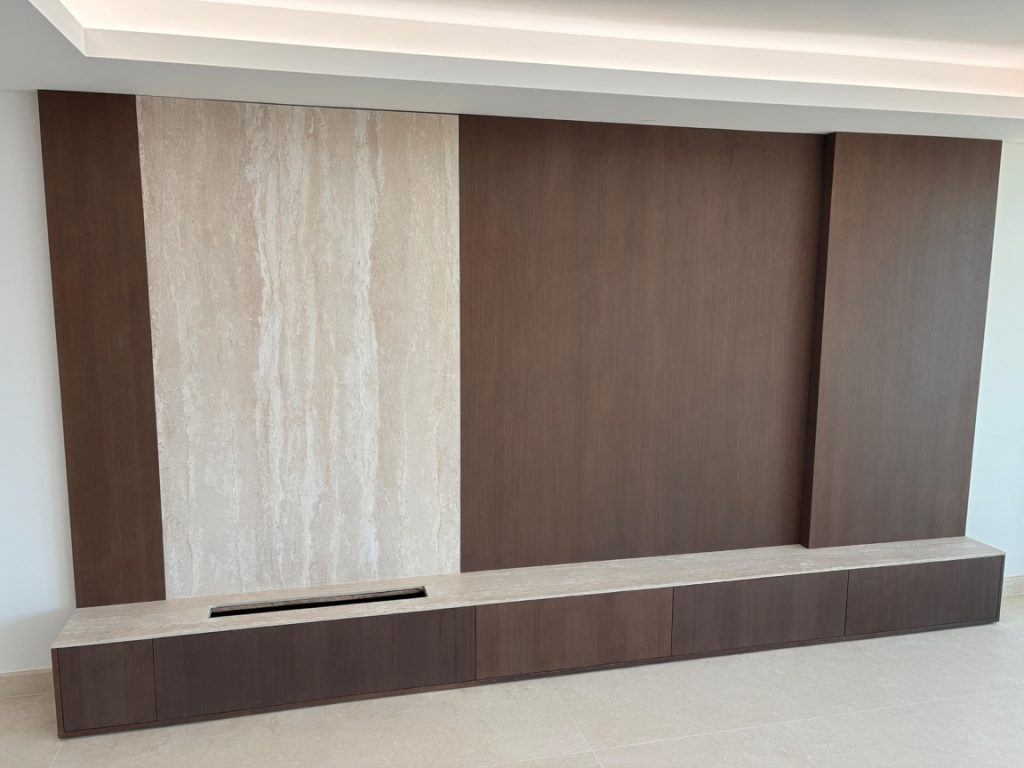 Porcelain fireplace surround with travertine effect installed in Marbella