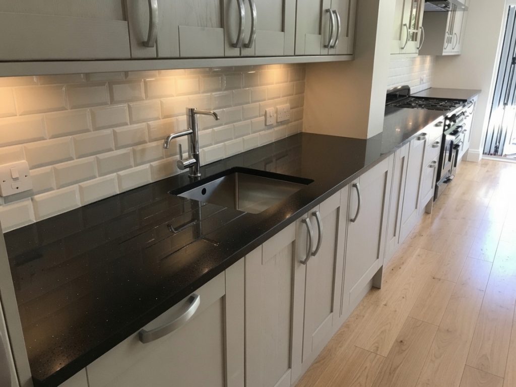 ilestone Negro Tebas black quartz kitchen worktops installed in Marbella