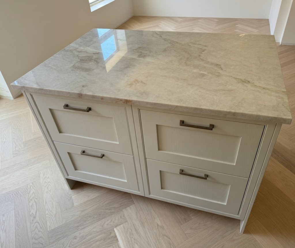 Taj Mahal quartzite kitchen island installed in a Marbella villa